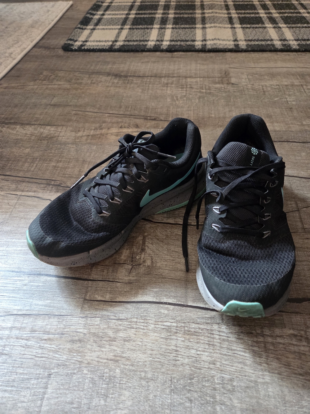 Nike Women's Black Sneakers with Teal Accents